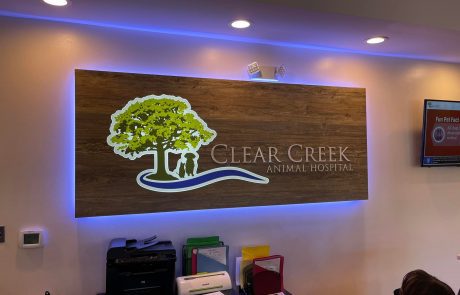 Indoor Lobby Sign, Brown Wood Background, Brownish grey letters, Clear Creek Animal Hospital