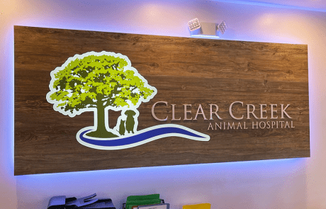 Indoor Lobby Sign, Brown Wood Background, Brownish grey letters, Clear Creek Animal Hospital