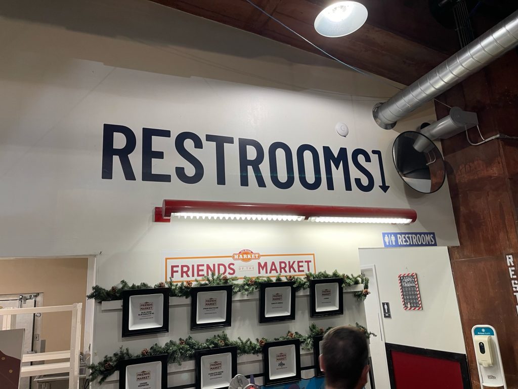 Indoor Restaurant Signage for a restroom at Friends Market