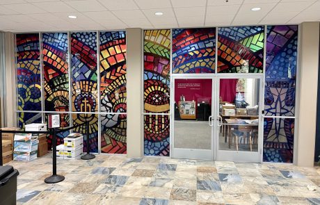 Indoor Environmental Sign that is multicolored similar to a stained glass window