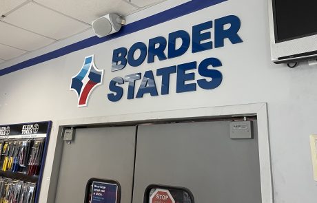 Indoor Custom Acrylic Lobby Sign, White background with Blue letters, Border States Logo