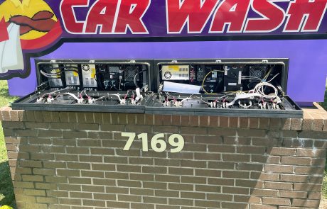 Brick sign with address number 7169 in off white letter, Car Wash Engine in side the brick.