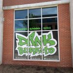 Window sign on a brown brick building, Opening Summer 2023, Dank Burrito