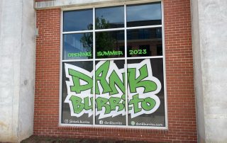 Window sign on a brown brick building, Opening Summer 2023, Dank Burrito